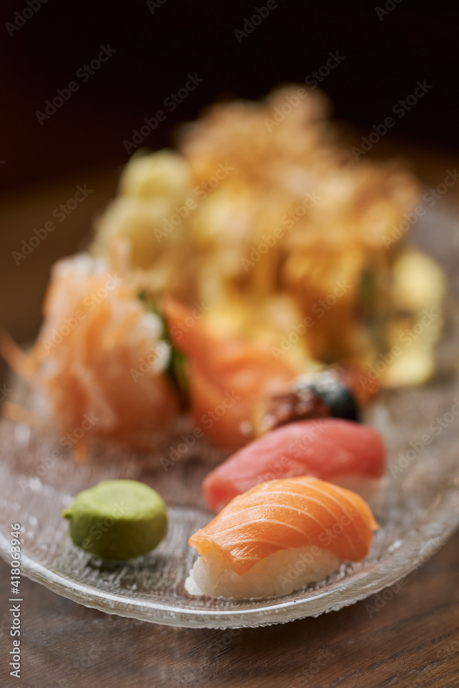 Delicious sushi set with sashimi and nigiri on a plate Delicious sushi set with sashimi and nigiri on a plate