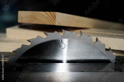Carpentry. Workshop tools. Table circular saw and timber
