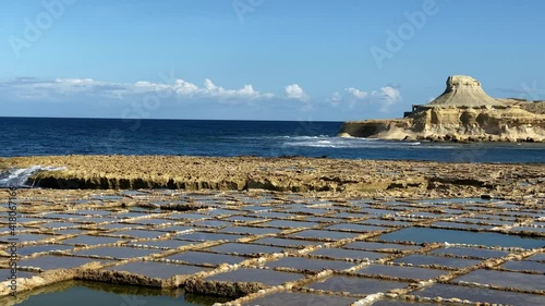 Historic rectangular patterned Xwejni salt pans, Gozo island, Malta, low angle