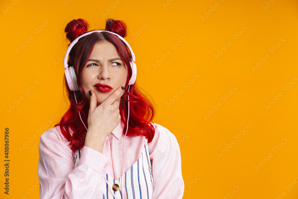 Displeased redhaired girl looking aside isolated - obrazy, fototapety, plakaty 