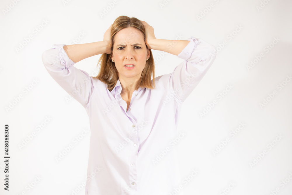 Portrait of young woman wearing casual clothes touching her head and expressing worry isolated over white background Portrait of young woman wearing casual clothes touching her head and expressing worry isolated over white background