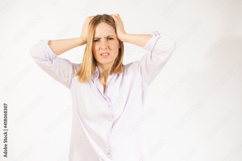 Portrait of young woman wearing casual clothes touching her head and expressing worry isolated over white background Portrait of young woman wearing casual clothes touching her head and expressing worry isolated over white background