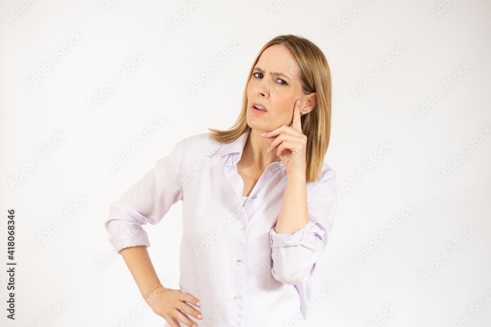 Attractive thoughtful young woman standing isolated over white background Attractive thoughtful young woman standing isolated over white background