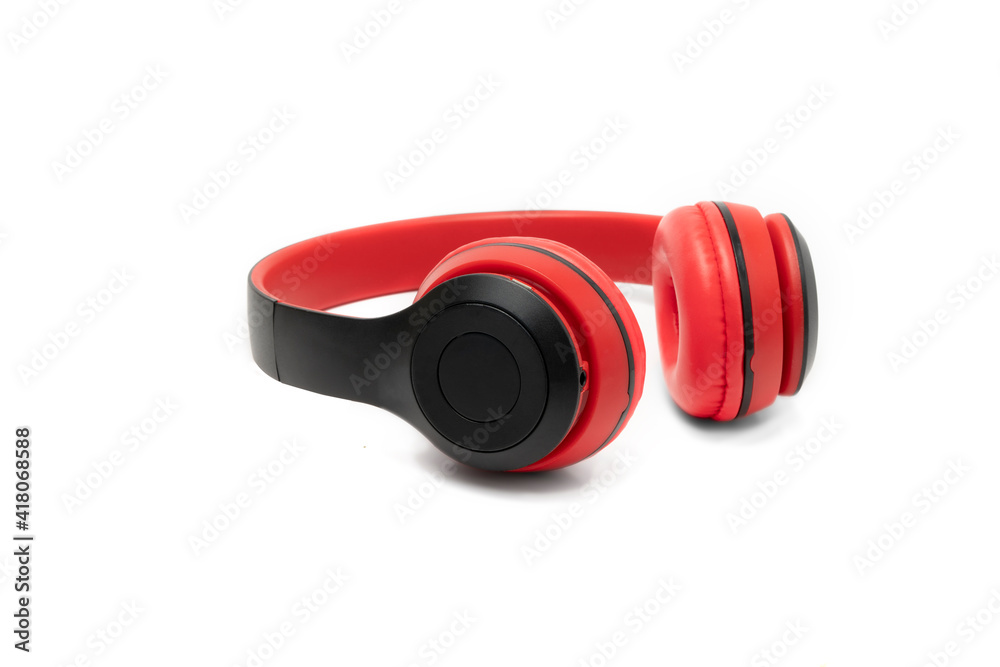 Red wireless Bluetooth headphones isolate on white background. Red wireless Bluetooth headphones isolate on white background.