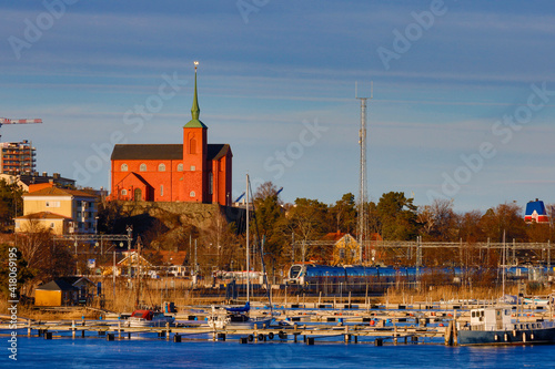 Nynashamn, Sweden  The city skyline,  church and harbor during the winter. photo