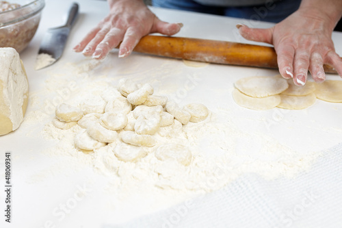 homemade dumplings in the kitchen without decorations. making dumplings with minced pork, beef and chicken