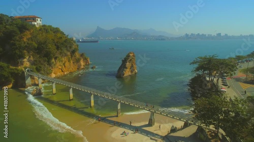 Aerial heading towards natural rock and Boa Viagem Bridge and Island in the Guanabara Bay photo