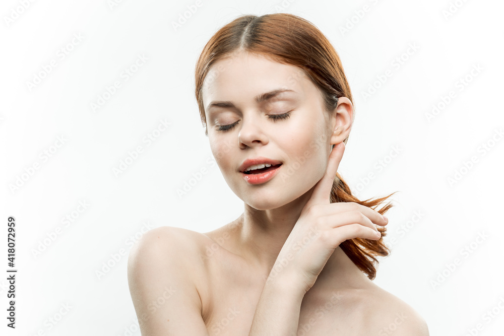 Fototapeta premium woman makeup on face naked shoulders gathered hair attractive look