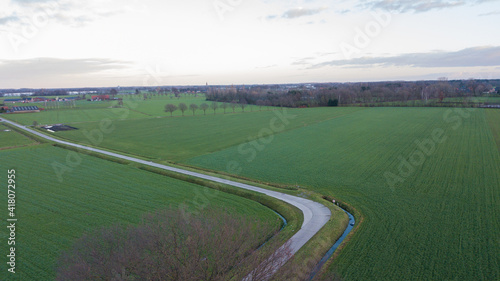 Wallpaper Mural Rural Road Through Countryside. Rows of Farmfields. Summer Landscape. Aerial Drone View. High quality photo Torontodigital.ca