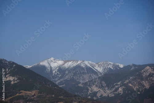 mountains with snow on the top and blue sky