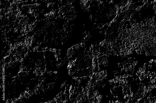 Texture of medieval crumbling stone basement wall. Large hard cobblestones of natural rocky block cement structure. Dirty broken bumpy shabby daub. Retro aged vintage messy masonry for design material