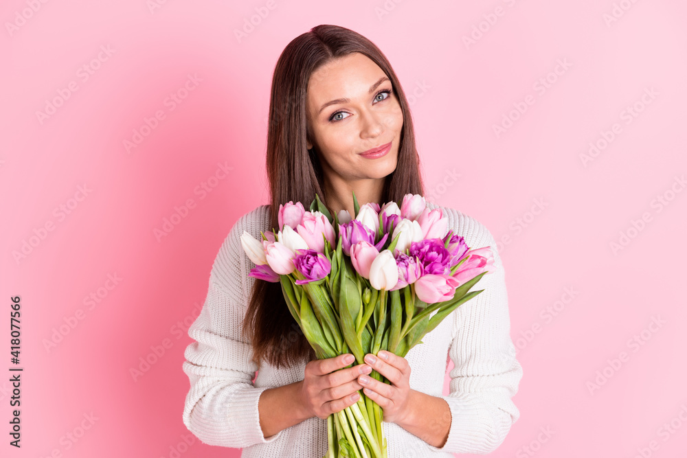 Photo of nice sweet charming young woman hold flower bouquet present holiday isolated on pink color background