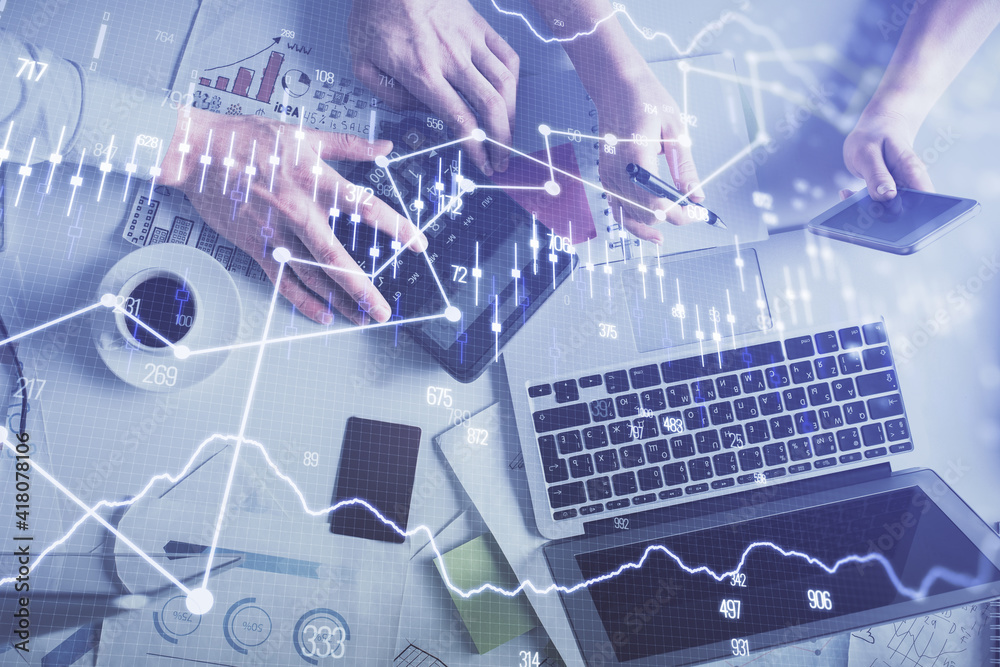 Double exposure of man and woman working together and financial chart hologram drawing. market analysis concept. Computer background. Top View. Double exposure of man and woman working together and financial chart hologram drawing. market analysis concept. Computer background. Top View.