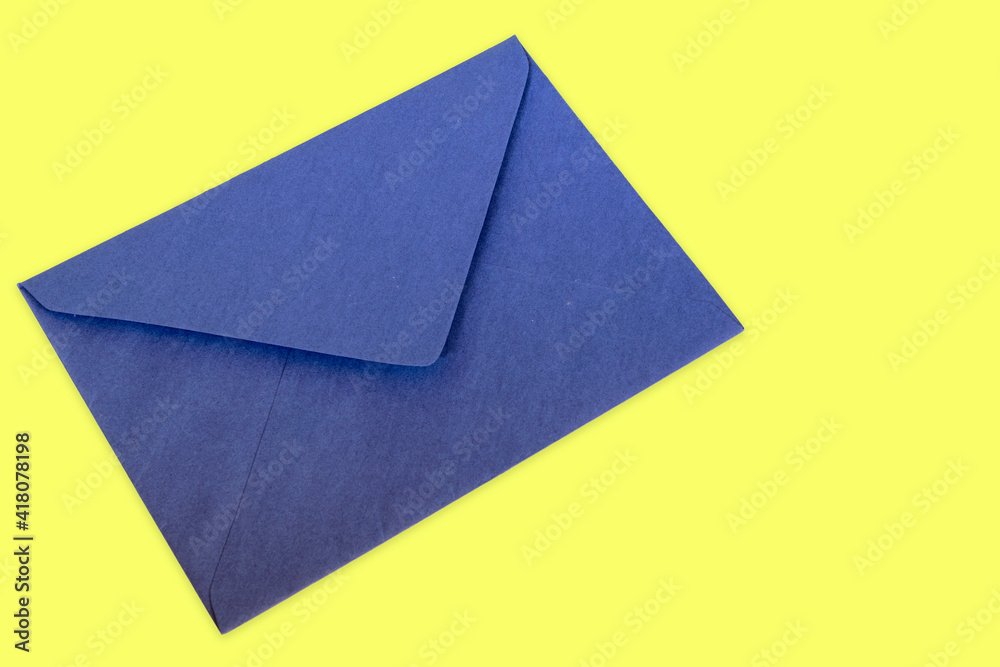 blue letter envelope on yellow background blue letter envelope on yellow background