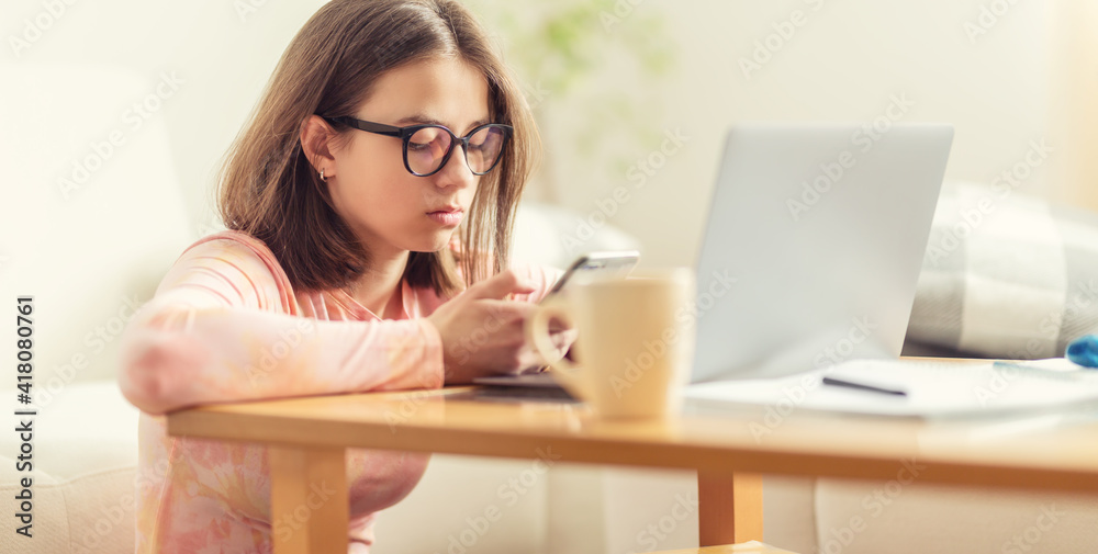Teenage girl using modern technologies during isolation in quarantine. Teenage girl using modern technologies during isolation in quarantine.