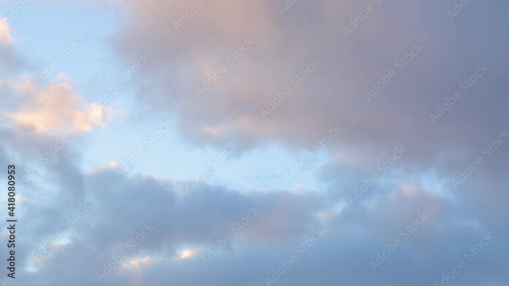 Blue-orange clouds running fast across the sky at sunset. Accelerated shooting. Blue-orange clouds running fast across the sky at sunset. Accelerated shooting.