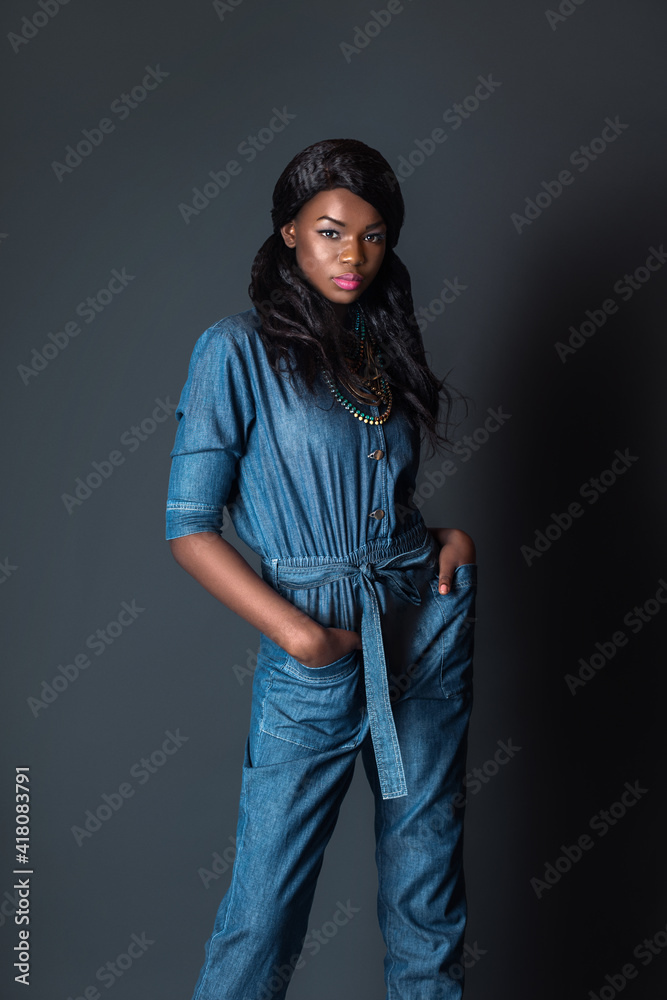 Portrait of an elegant black woman with curly long black hair and ...