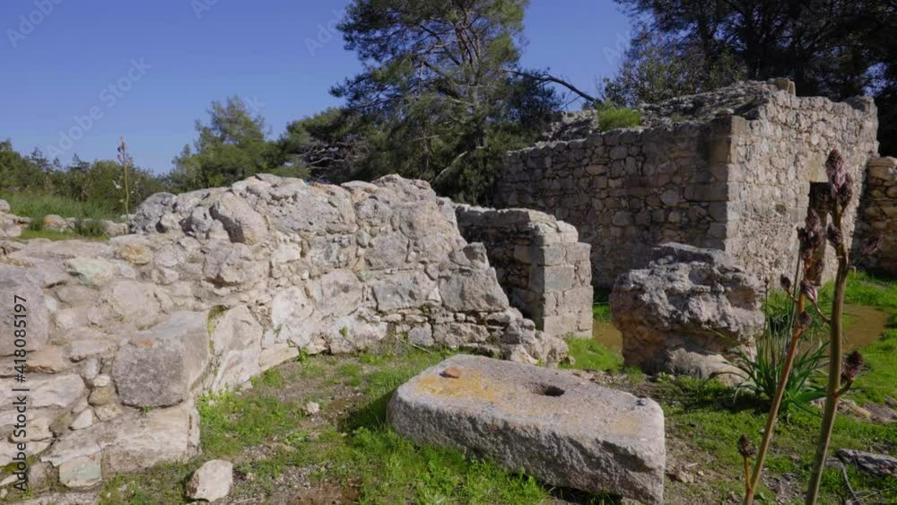 Close-up view of the crumbled stone walls of Pyrgos tis Rigenas, Rigena Tower byzantine monastery in Akamas, Cyprus. Close-up view of the crumbled stone walls of Pyrgos tis Rigenas, Rigena Tower byzantine monastery in Akamas, Cyprus.