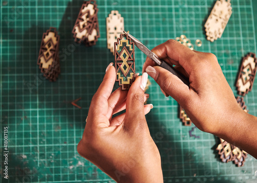 close up of person making jewellery 