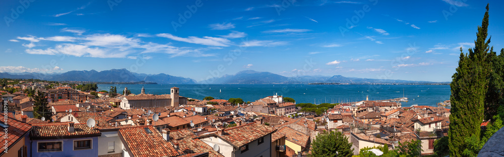 Panoramic view of Desenzano del Garda, a resort town on the southern shore of Lake Garda in  Northern Italy. Lake Garda is the largest lake in Italy and a popular holiday location on the edge of the D