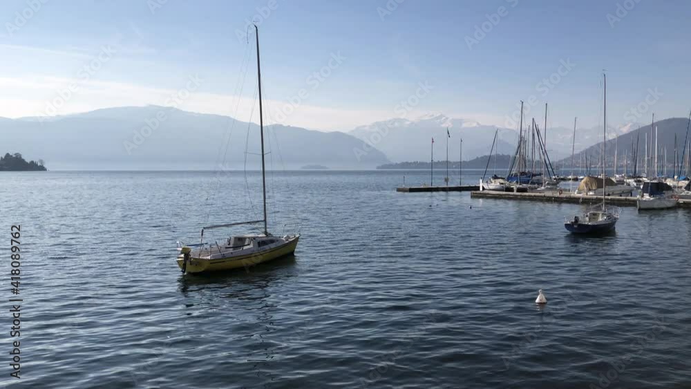 Sailboats on the water of Lake Maggiore of Laveno Mombello harbor, Lombardy, Italy Sailboats on the water of Lake Maggiore of Laveno Mombello harbor, Lombardy, Italy