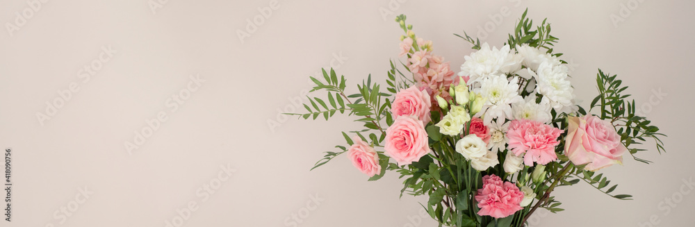 Banner of flower plants on light pink wall background 