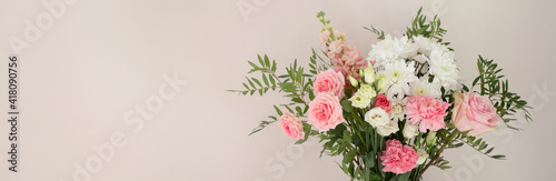 Banner of flower plants on light pink wall background 