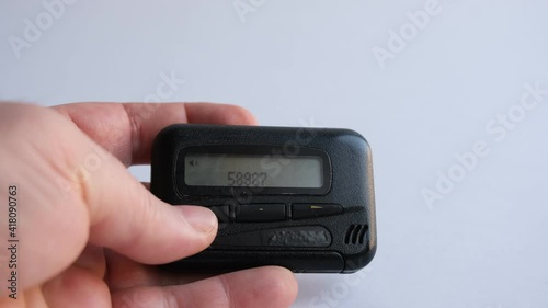pagers, old vintage beeper, pager in hand photo