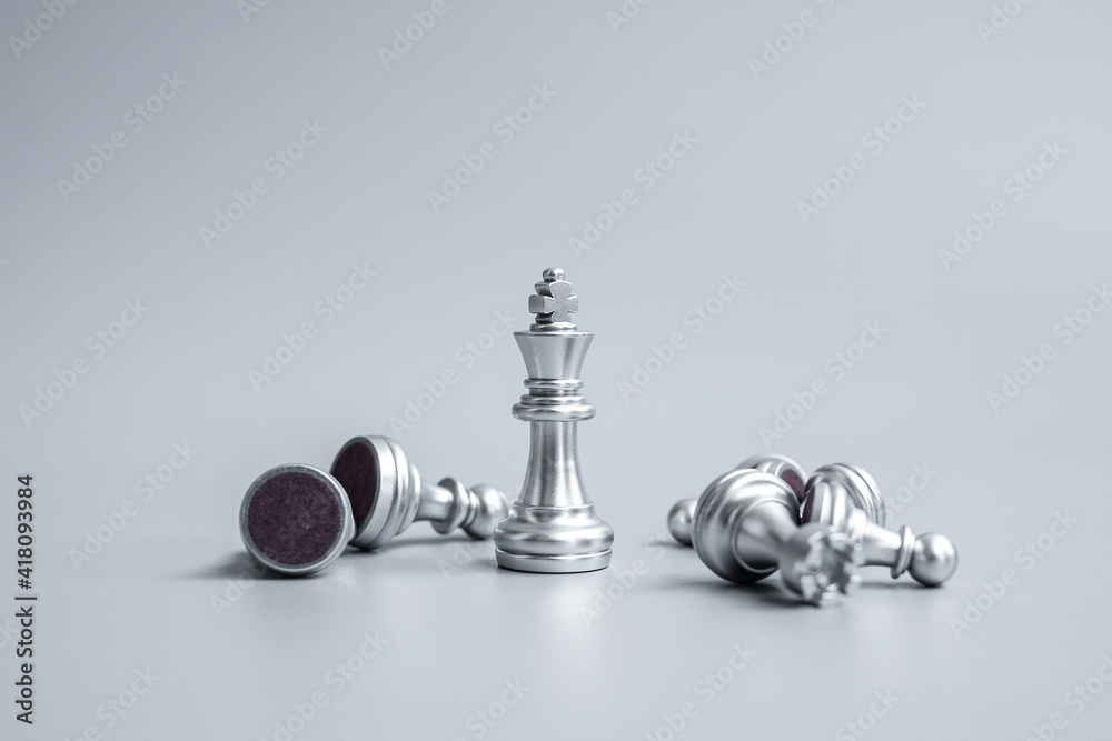 Chess king figure stand out from crowd of enermy or opponent during chessboard competition. Strategy, Success, management, business planning, disruption, win and leadership concept Chess king figure stand out from crowd of enermy or opponent during chessboard competition. Strategy, Success, management, business planning, disruption, win and leadership concept
