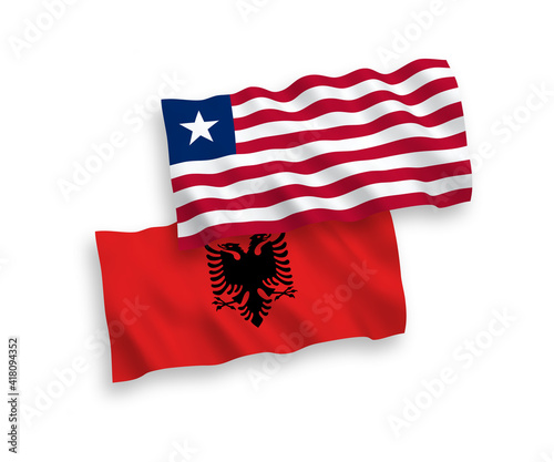 Flags of Liberia and Albania on a white background