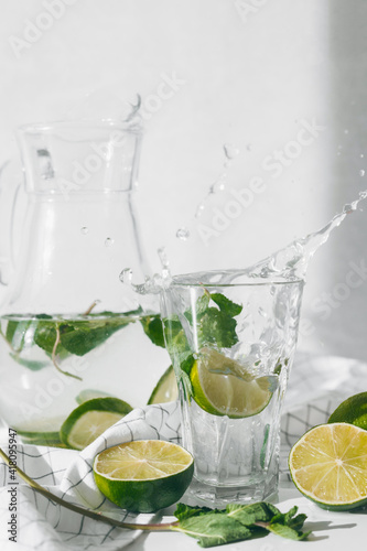 Detox water with lime fruit and mint leaves. Mint fresh homemade lemonade