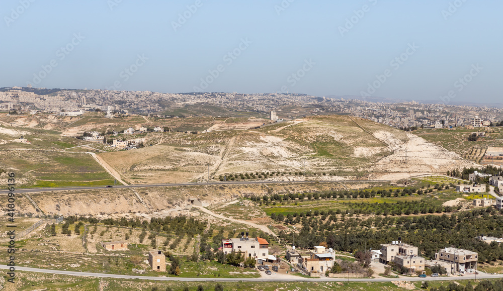 View  from the walls of the ruins of the palace of King Herod - Herodion of the nearby Jewish and Arab settlements in the Judean Desert, in Israel