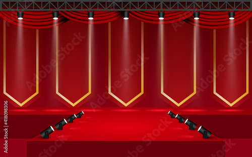red stage with spotlight on the truss system in the hall