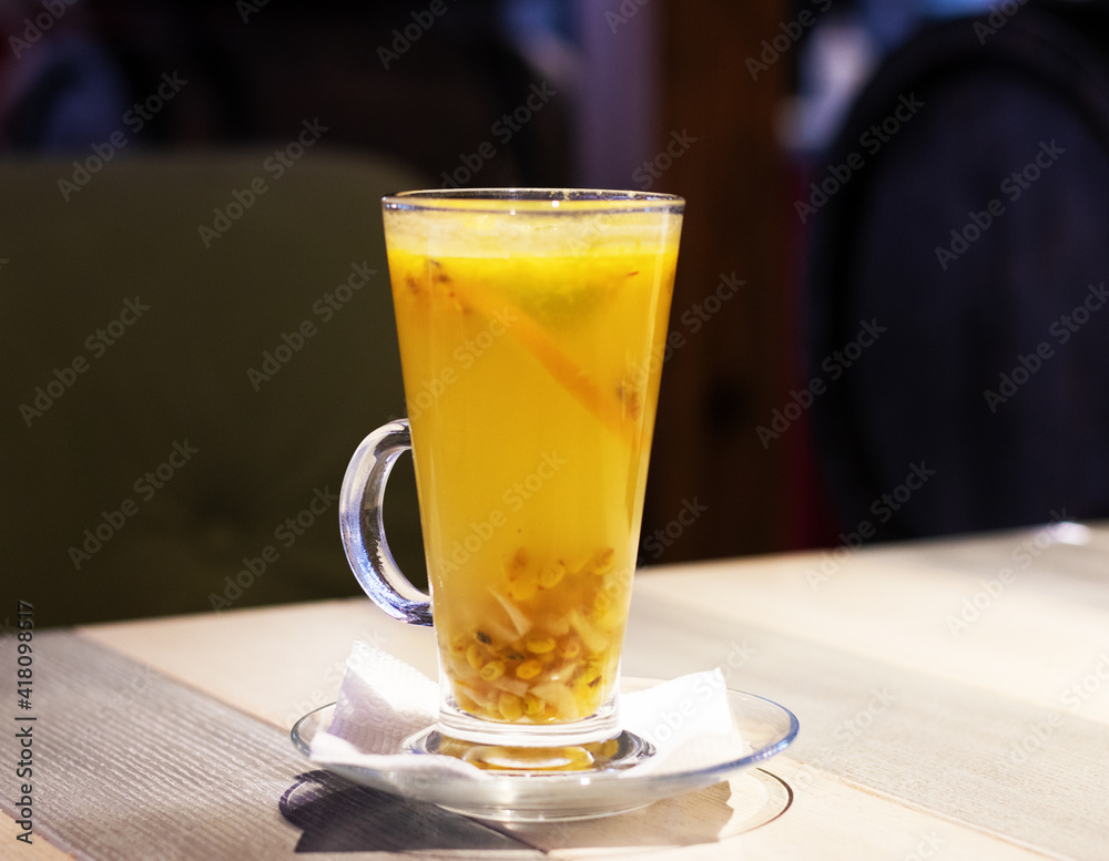 Fruit tea with strawberries on a wooden table Fruit tea with strawberries on a wooden table