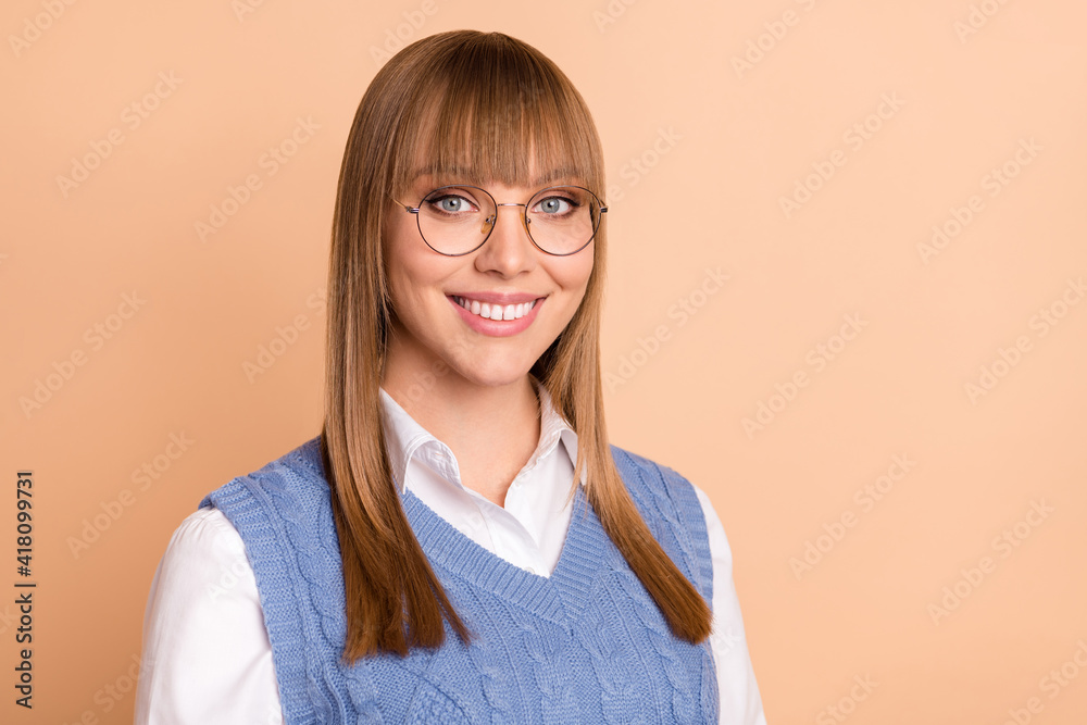 Photo portrait of female student smiling happy wearing spectacles formalwear isolated on pastel beige color background Photo portrait of female student smiling happy wearing spectacles formalwear isolated on pastel beige color background