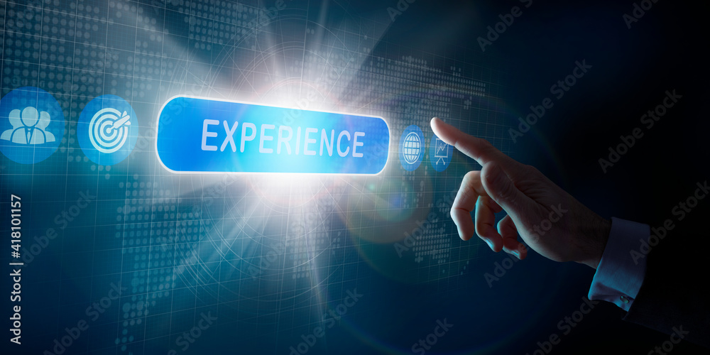 A businessmans hand selecting an Experience business word concept on a computer display. A businessmans hand selecting an Experience business word concept on a computer display.