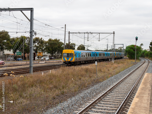 Commuter train approaching a train station in Melbourne Victoria Australia