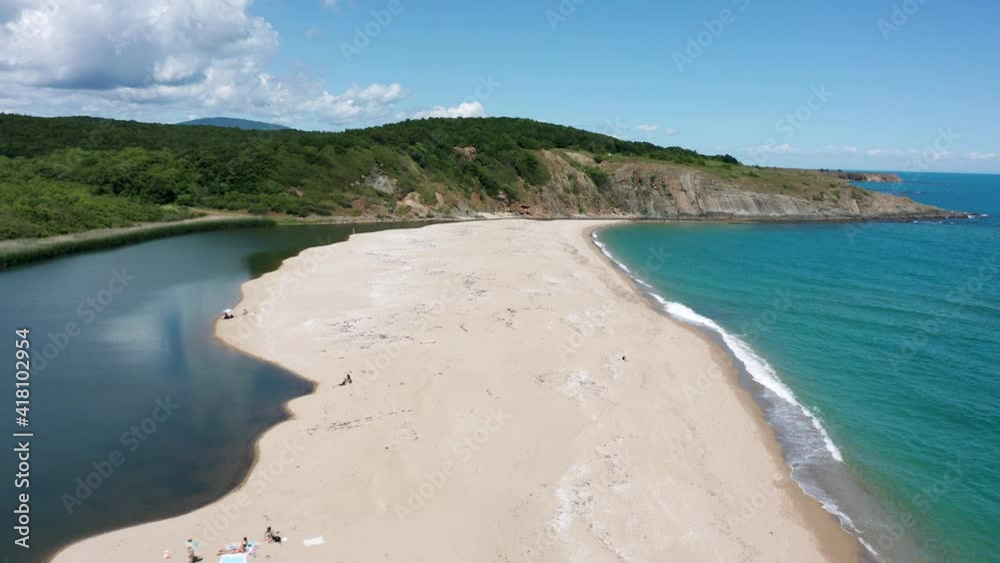Drone flight over a picturesque sandy beach with unrecognizable people Drone flight over a picturesque sandy beach with unrecognizable people