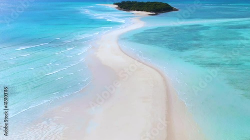 Aerial orbit and dolly of incredible Nosy Iranja island spit off a short cruise from Nosy Be, Madagascar photo