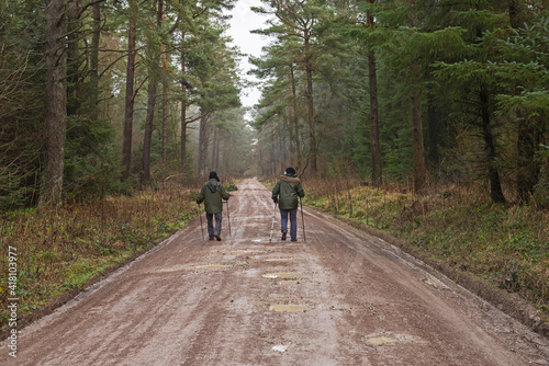 Couple walking on footpath through rural countryside woodland © Paul Vinten