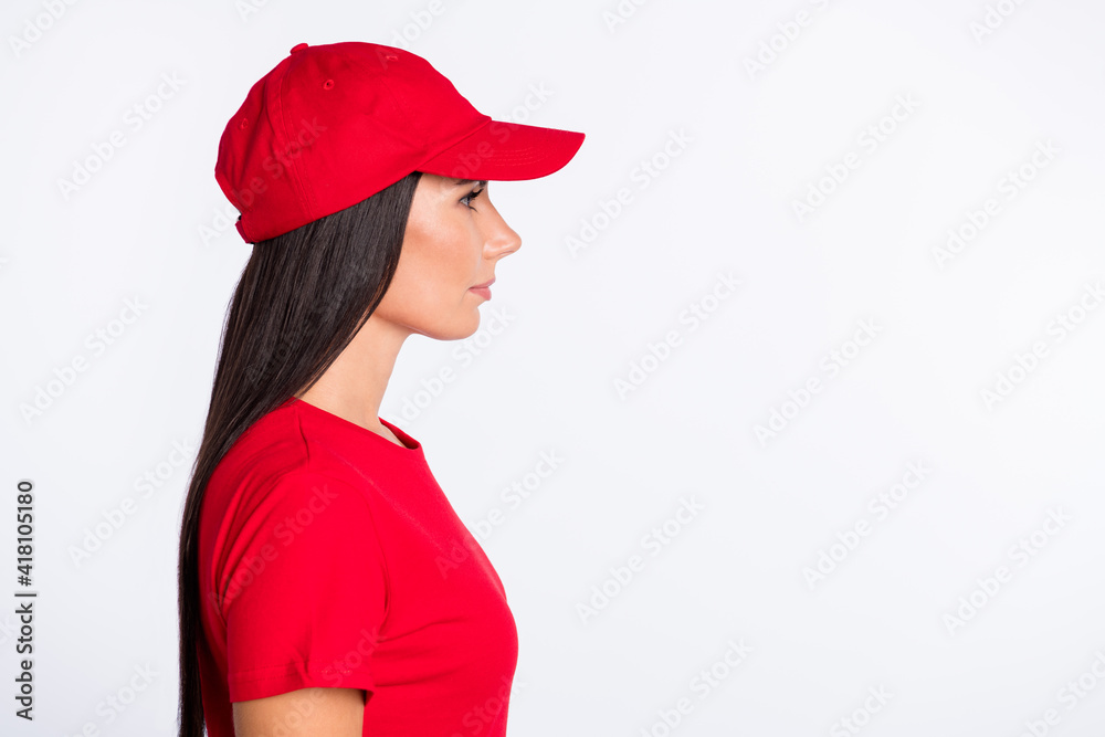 Profile side photo of young serious beautiful service delivery woman look copyspace isolated on grey color background Profile side photo of young serious beautiful service delivery woman look copyspace isolated on grey color background