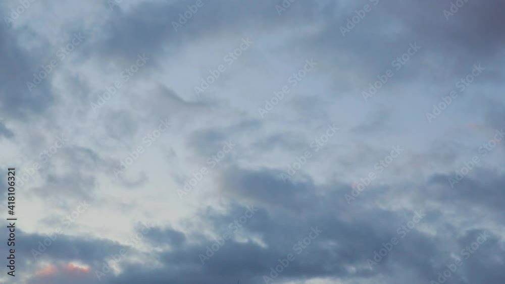 Blue-orange clouds running fast across the sky at sunset. Accelerated shooting. Blue-orange clouds running fast across the sky at sunset. Accelerated shooting.