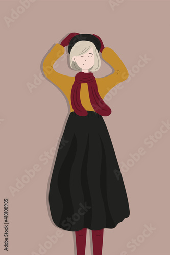 Portrait of a cute young French lady with short haircut wearing a long skirt and a scarf holding the beret on her head