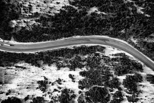 Aerial view on mountain road from drone in winter. © Ruslan