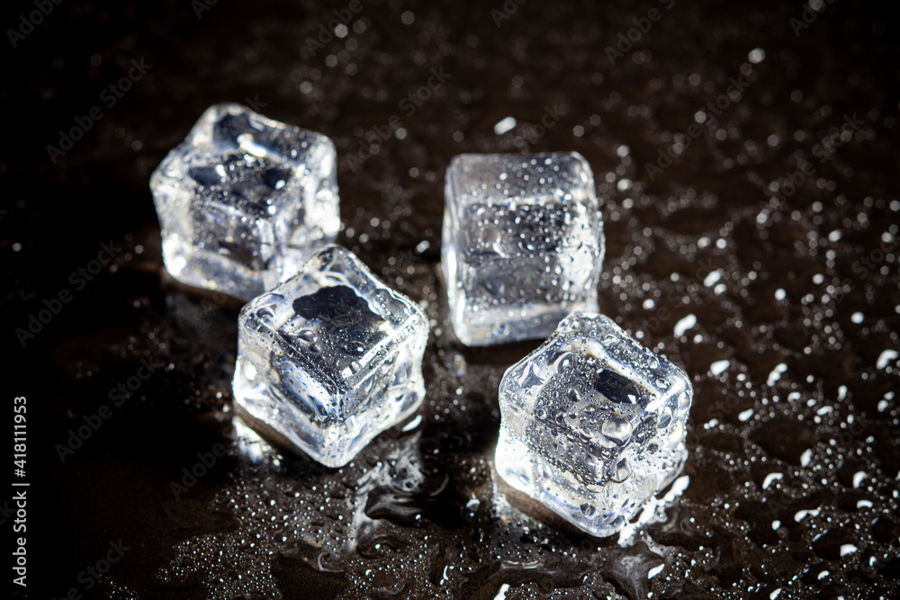 ice cubes reflection on black table background. ice cubes reflection on black table background.