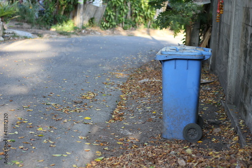 Blue trash bin on the roadside
