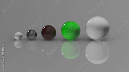 five glass balls of different sizes