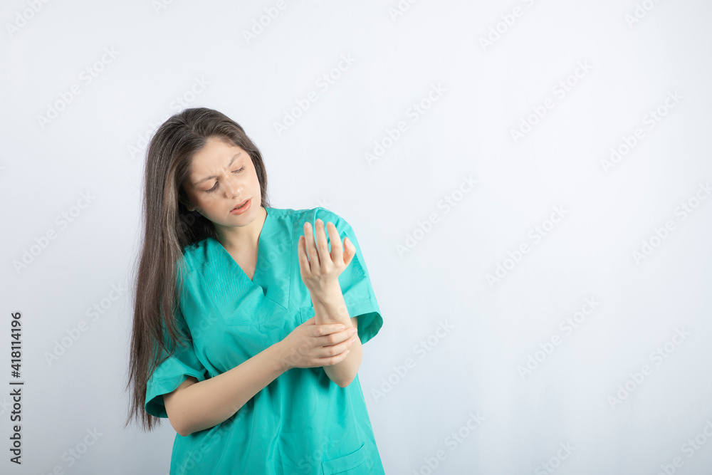 Tired medical worker girl massaging herself's neck Tired medical worker girl massaging herself's neck