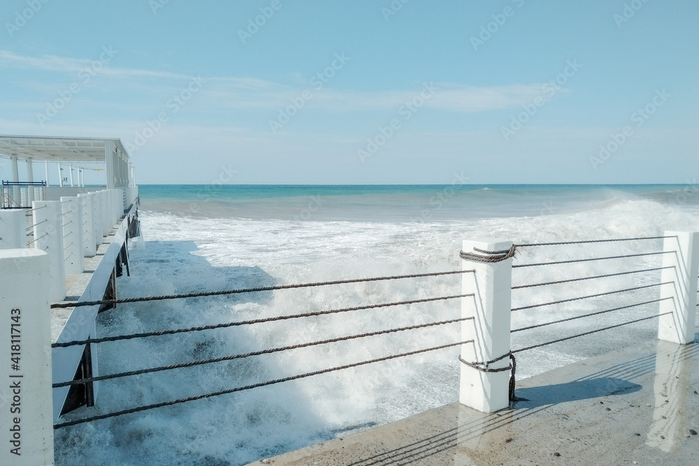 Waves crash on the shore. Storm into the rocky beach. Landscape of Batumi, Georgia