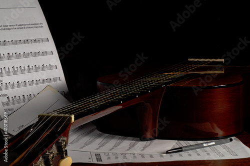 guitar and music notes on dark background